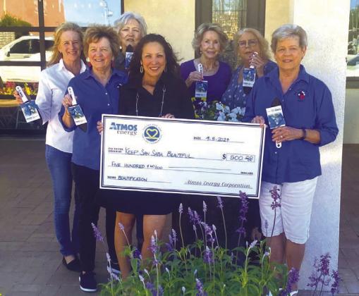 Picture is left to right in front holding check is Leticia Saenz (Atmos) and Gale Ivy (KSSB); others are Cissy Williams, Debbie Shahan, Rhonda Killion, Kathleeen Hawkins, and Sandra Vaugh (KSSB Board Directors). Not pictured are Directors Marcie Butler and Lucia Martinez. Courtesy of Sarah Saldivar
