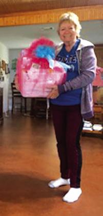 Sue Ransom is proudly holding her grand prize she won at the Quilting Show last Friday in Brownwood.